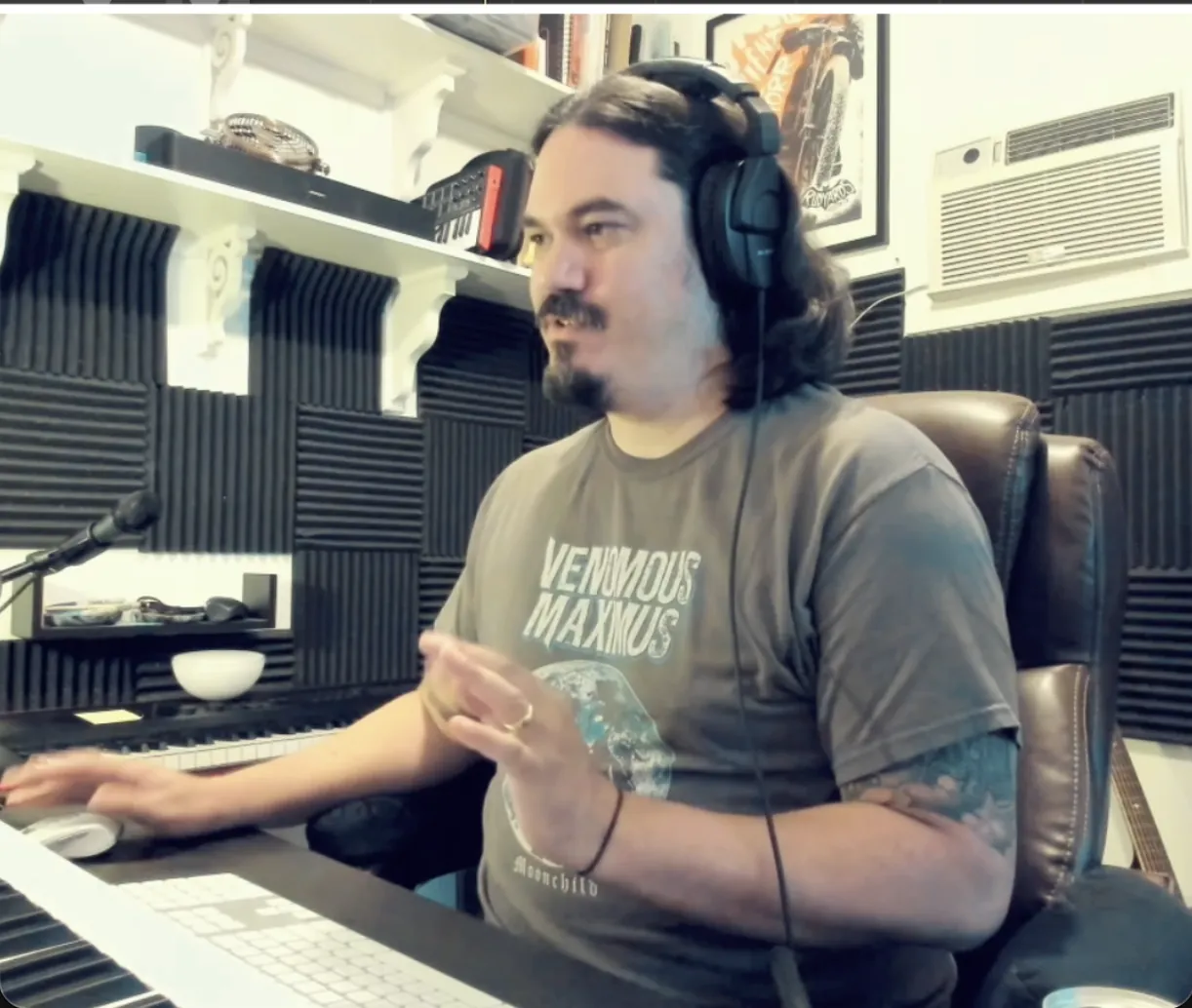 John D. Leon at the keyboard in his studio